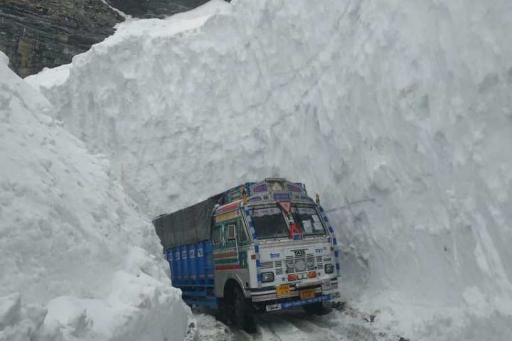 Truck plying through high walls of snow at Rahni nullah below Rohtang pass